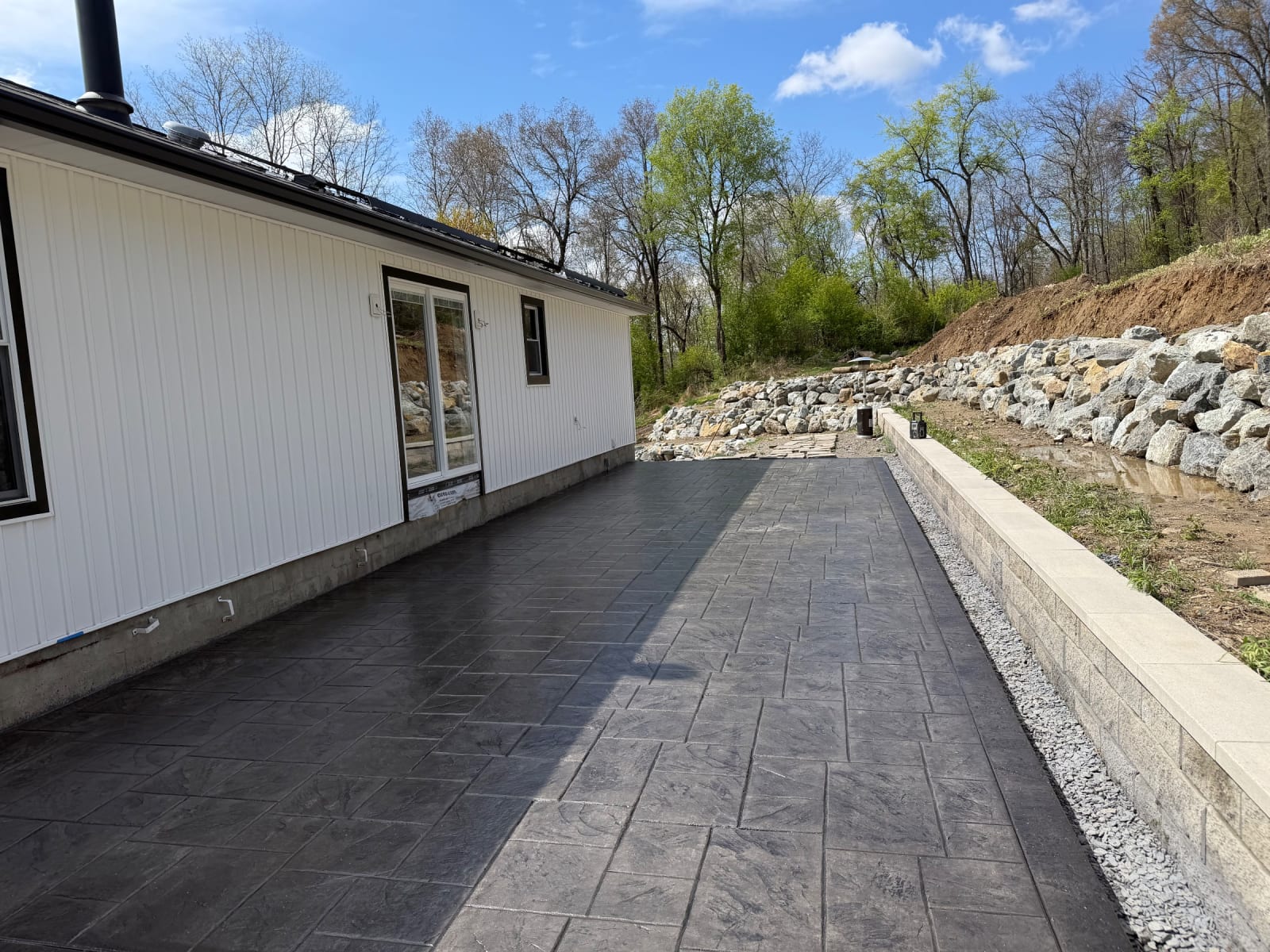 Stamped entry along the rock wall by Legacy Concrete, Poughkeepsie